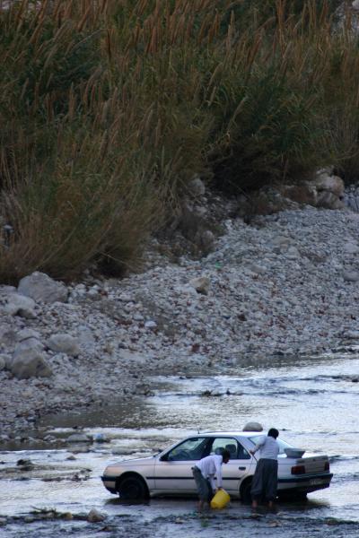 Washing car in river